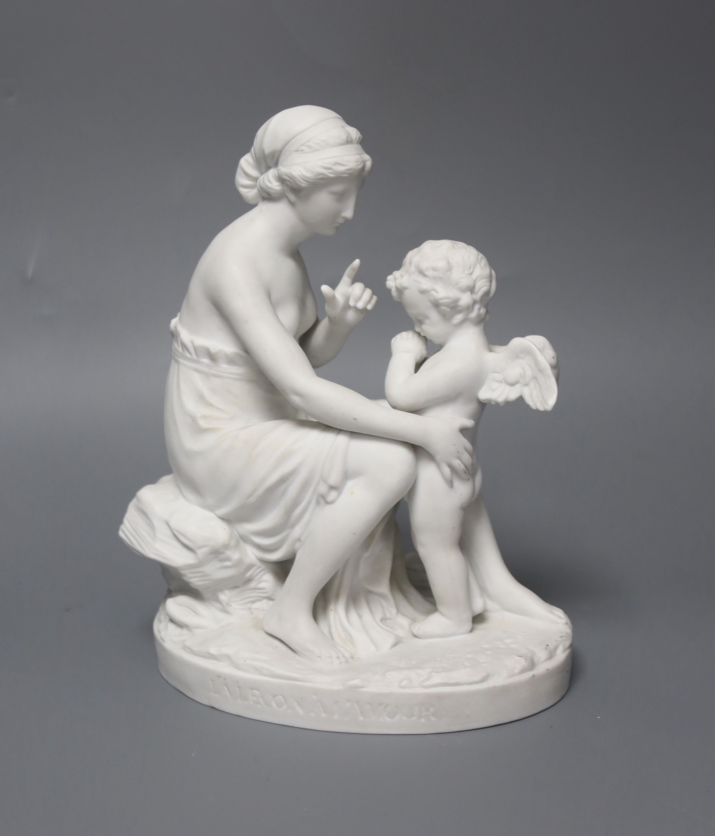 A Sevres biscuit porcelain group, ‘La Lecon a L’ Amour ’, 21cm high.